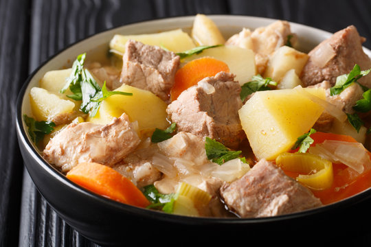 German soup Pichelsteiner or Bismarck stew with vegetables and three kinds of meat close-up in a bowl. horizontal