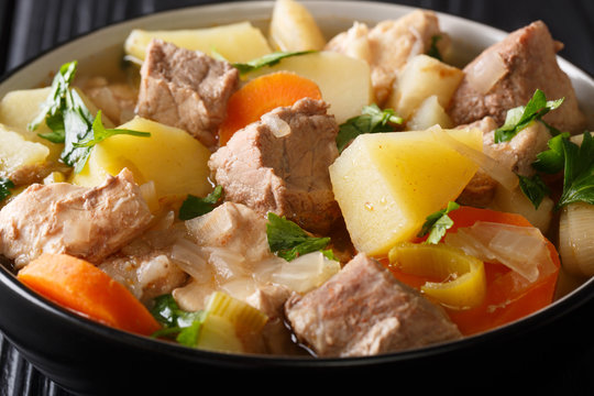 Pichelsteiner is a German stew that contains several kinds of meat and vegetables close-up in a bowl. horizontal