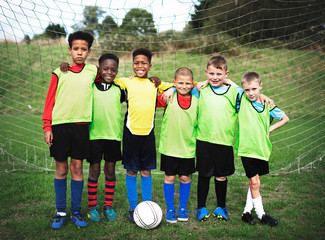 Junior football team standing together