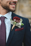 Close up of a groom with a boutonniere