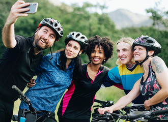 Group of cyclists taking a selfie in the nature