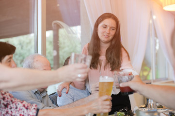 beautiful big family celebrating anniversary in restaurant