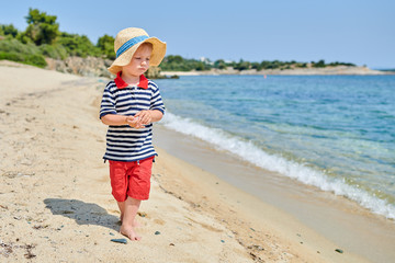 Toddler boy on beach