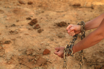 Woman Hands In Iron Rusty Chains