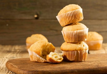 Vanilla cupcake, homemade cakes on wooden background
