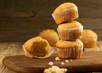 Vanilla cupcake, homemade cakes on wooden background