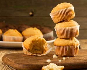 Vanilla cupcake, homemade cakes on wooden background