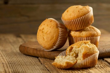 Vanilla cupcake, homemade cakes on wooden background