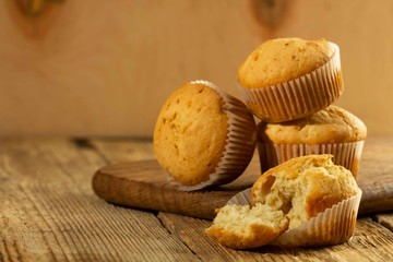 Vanilla cupcake, homemade cakes on wooden background