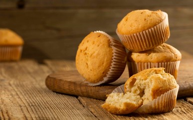 Vanilla cupcake, homemade cakes on wooden background