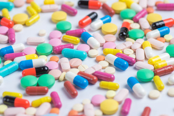 Tablets and pills on a white background