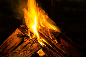 Hot fire flames of wood fire in cold winter night