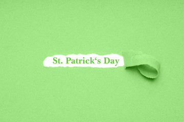 St. Patrick's Day is celebrated on March 17 - the irish national holiday is also known as Paddy's Day in Ireland - green paper background