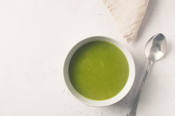 Green vegetable soup on white background minimalism