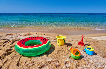 Beach with inflatable ring and toys
