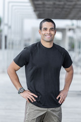 Handsome personal trainer with friendly smile