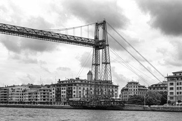 Fototapeta premium the suspension bridge of bizkaia (puente de vizcaya) between getxo and portugalete over the ria de bilbao, black and white