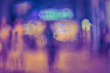 Abstract circular bokeh background of night light with raindrops