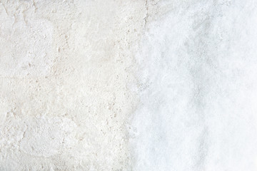 Snow texture on white concrete background. Outdoor old floor covered with snow.