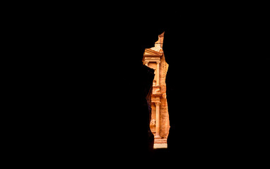 The beautiful Al Khazneh (The Treasury) seen through a canyon's walls in Petra. Petra is a historical and archaeological city in southern Jordan.