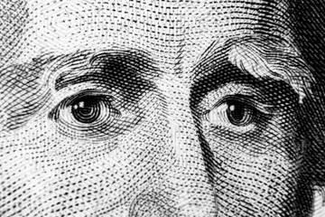 Close up view Portrait of Andrew Jackson on the one twenty dollar bill. Background of the money. 20 dollar bill with Andrew Jackson eyes macro shot. Money background. Face portrait. Black and white