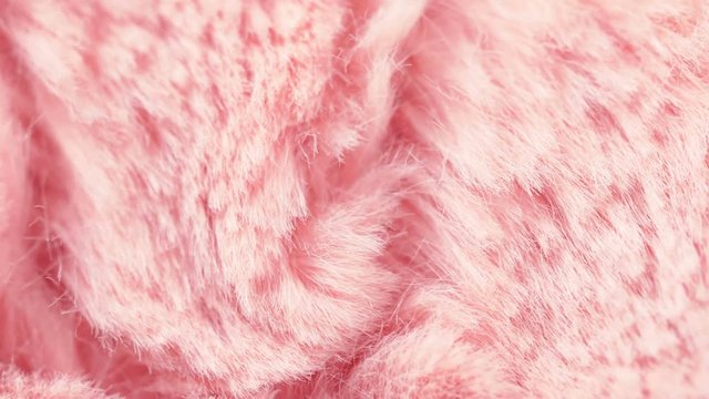 Pink coral fur close up 4k footage. Soft fabric rotating.