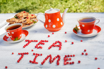 Time to drink tea outdoors in the garden. Summertime scene
