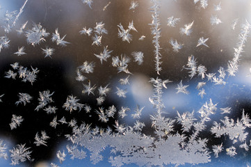Frost and snowflakes on the window glass