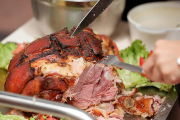 waiter serves roasted meat and baked potatoes at the party or wedding reception