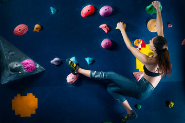 Successful strong confident muscle woman female alpinist climber climbing  to dreams goals, get...