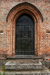 Fototapeta na wymiar Door of old chapel at cemetery in Finland.