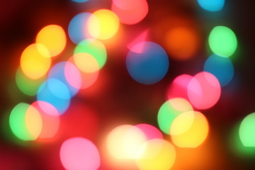 Bokeh light that has many spherical shapes and many colors on the background with blur and darkness.