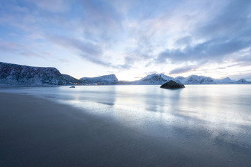 Fototapeta na wymiar Long exposure polar night landscape of beach with mountain in the winter