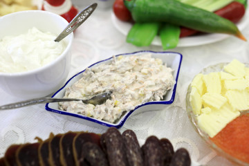 Plates with salad and snack