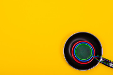 Kitchen utensils isolated on yellow background