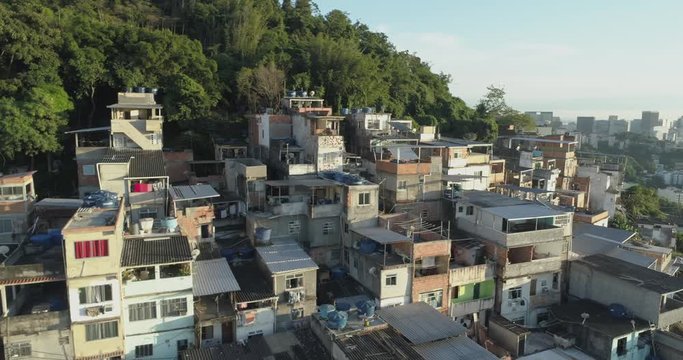 Aerial flying past hilltop favela houses in Rio de Janeiro, Brazil