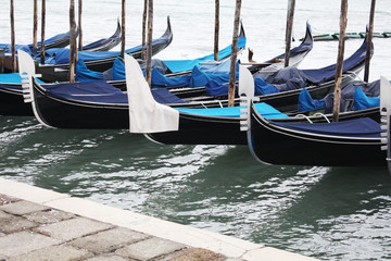 Fototapeta na wymiar Gondolas in Venice Italy Adriatic sea. Markusdom. St Mark's Basilica Square. Saint Marco Square.