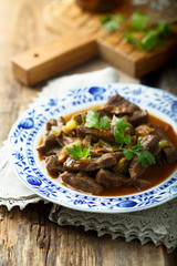 Beef goulash with pickled cucumber