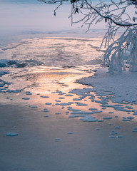 Icy winter sunset river