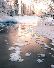 Icy winter sunset river