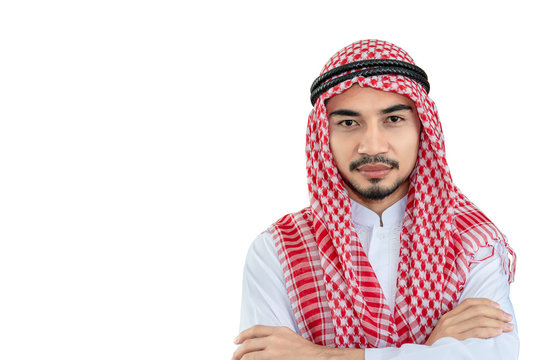 Modern young arabian  businessman with arms crossed isolated on white background .Saudi emirates man with  mustache posing with folded arms .