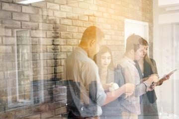 Teamwork of young asian business people working success smart deal and celebrate in modern office.Togetherness happiness colleagues people business group ,celebration success for work concept