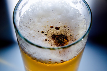 glass of beer on dark background,glass of cold beer on the table. object on a black background, а...