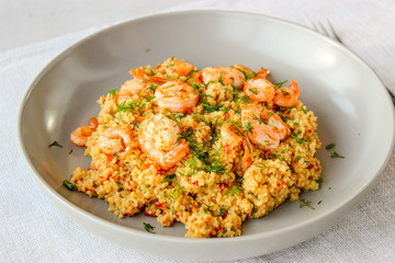 Grits cous cous with vegetables and grilled shrimp