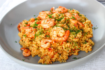Grits cous cous with vegetables and grilled shrimp