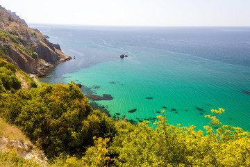 Landscape sea waves line impact rock on the beach. Stones at the beach with wave and nice blue sky. turquoise water