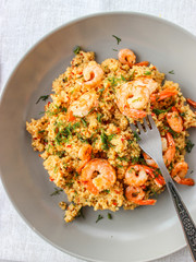 Grits cous cous with vegetables and grilled shrimp