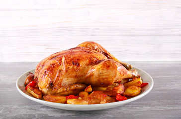 Baked chicken with vegetables on plate,