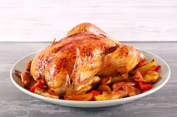 Baked chicken with vegetables on plate