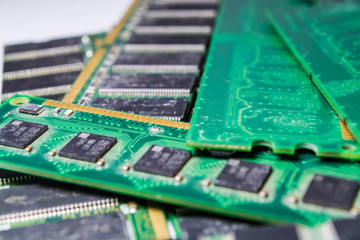 Old and dusty memory cards from the PC. Diskettes. Motherboard. Repair of the computer. Green...